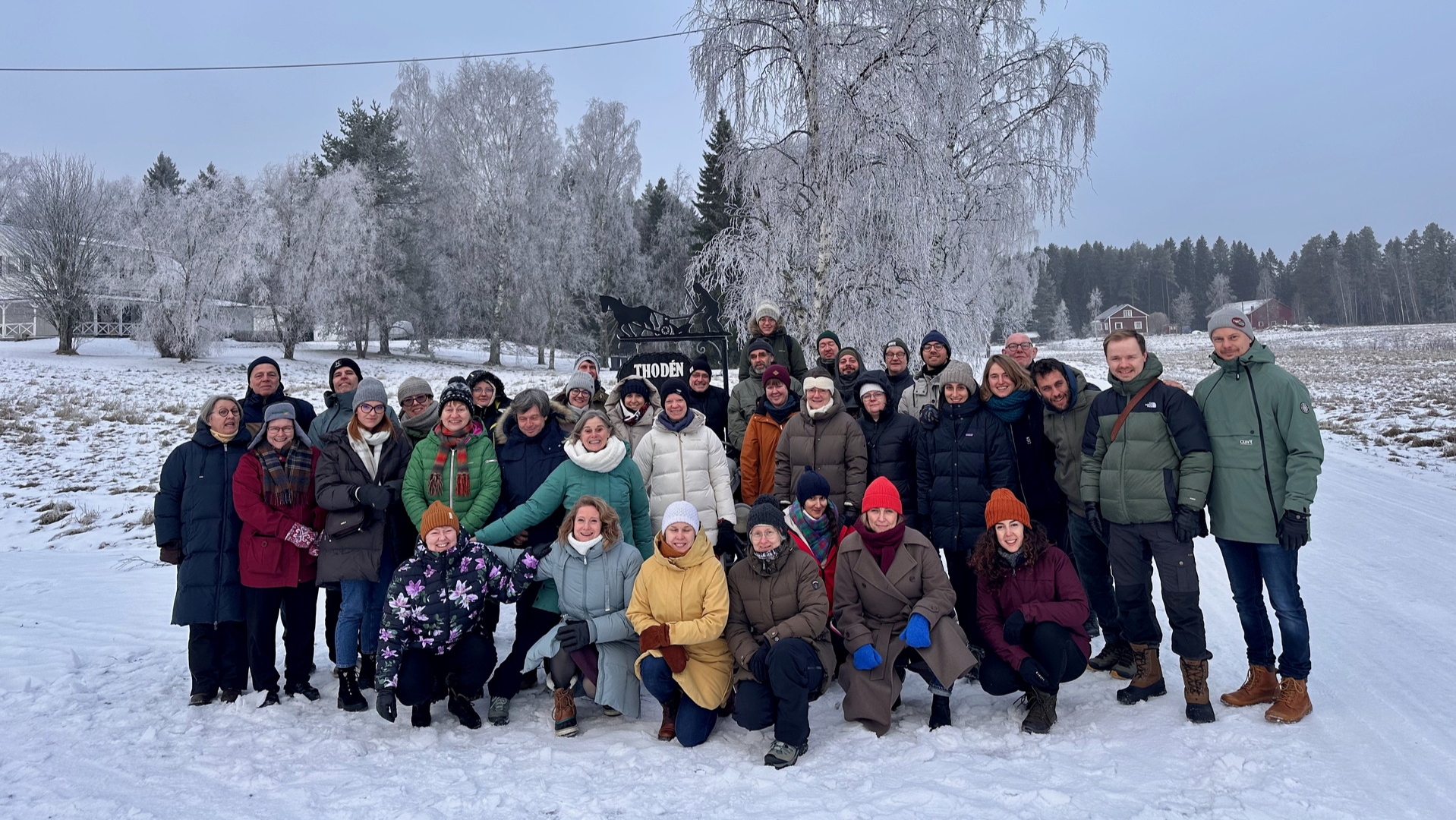 Group photo of EVECSA partners, in a snow setting.